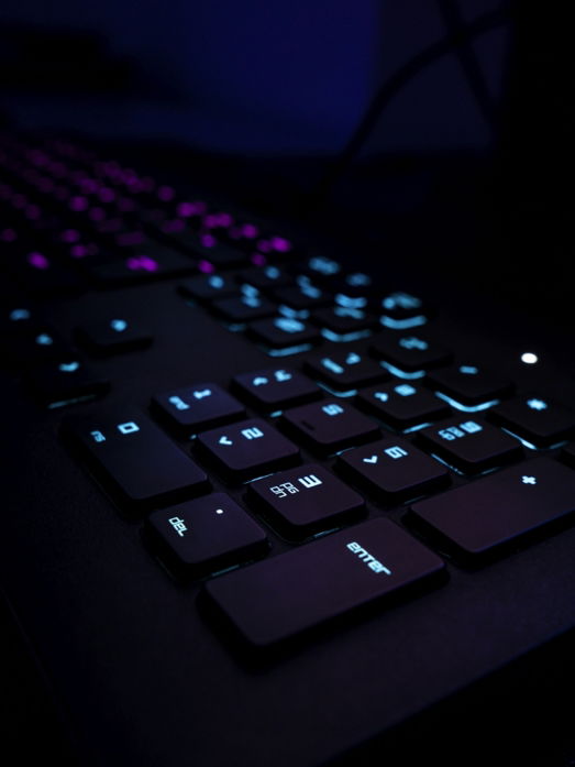 black computer keyboard on blue textile